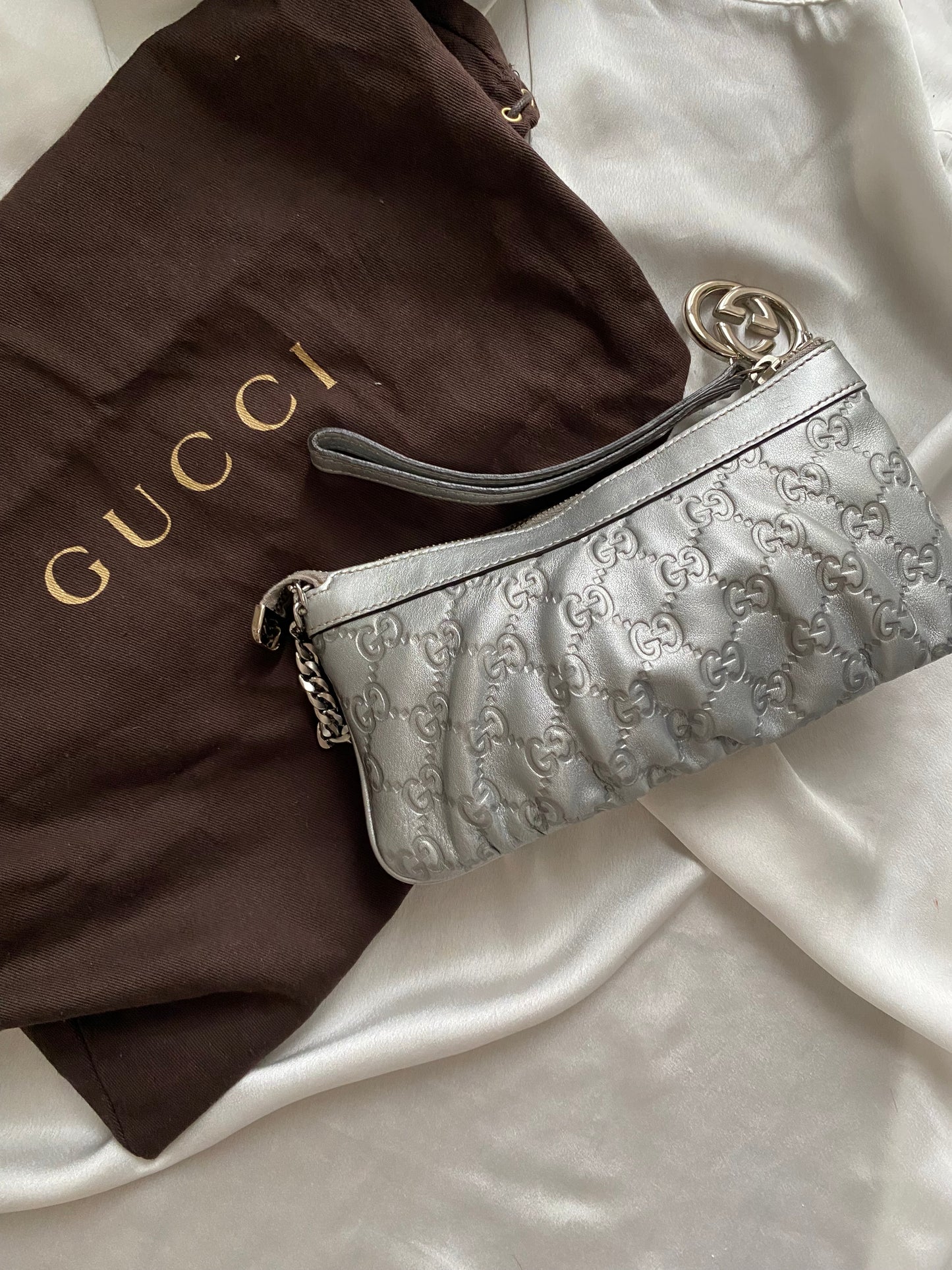 Gucci Pochette monogram pelle argento