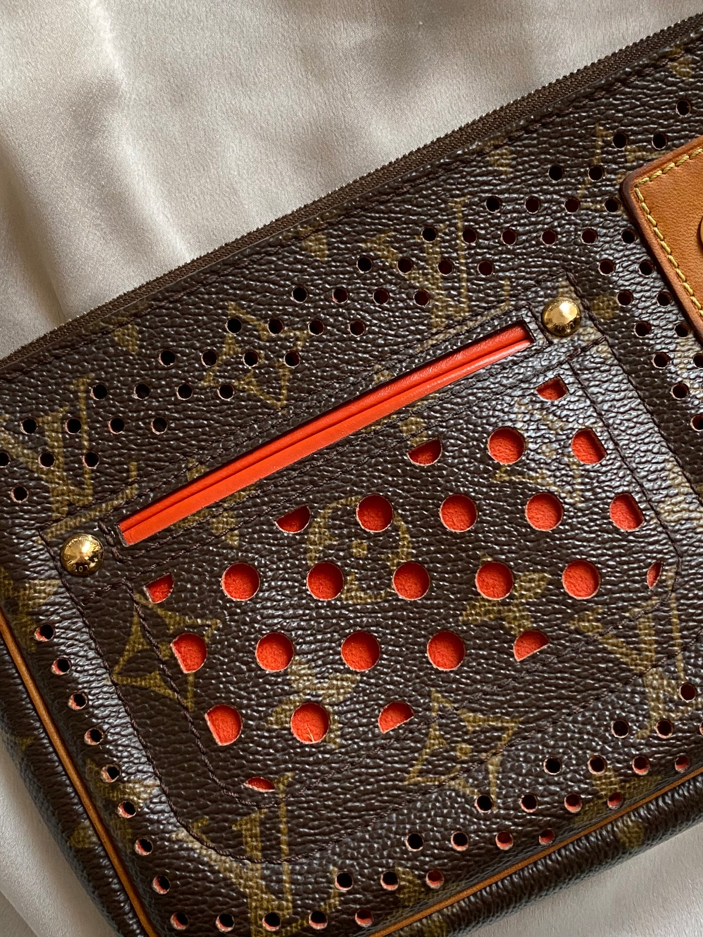 Louis Vuitton pochette accessoire perforated orange