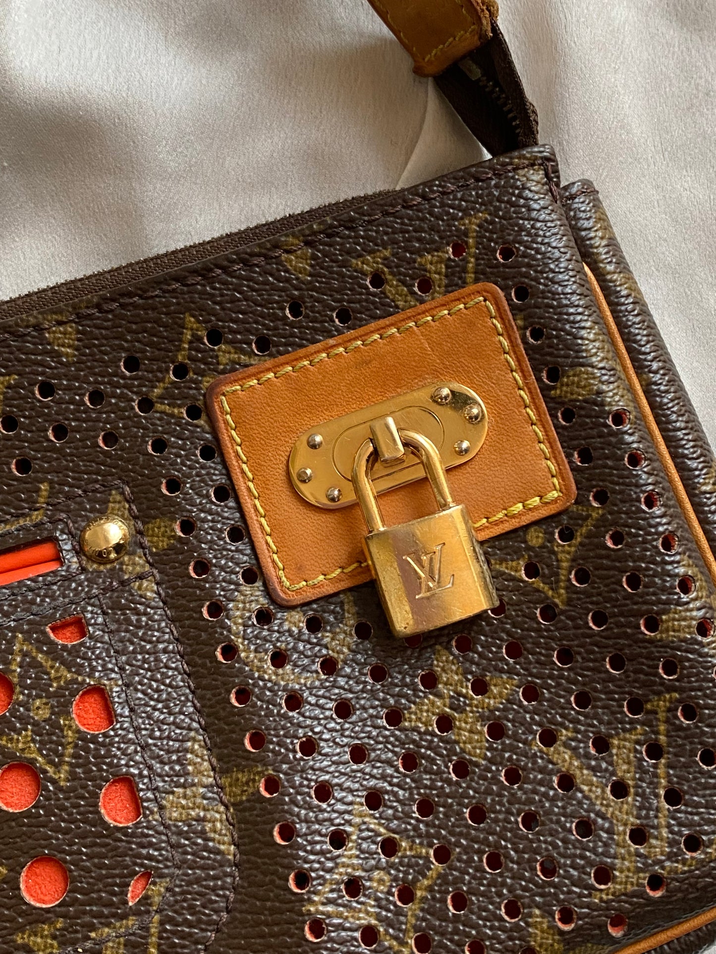 Louis Vuitton pochette accessoire perforated orange