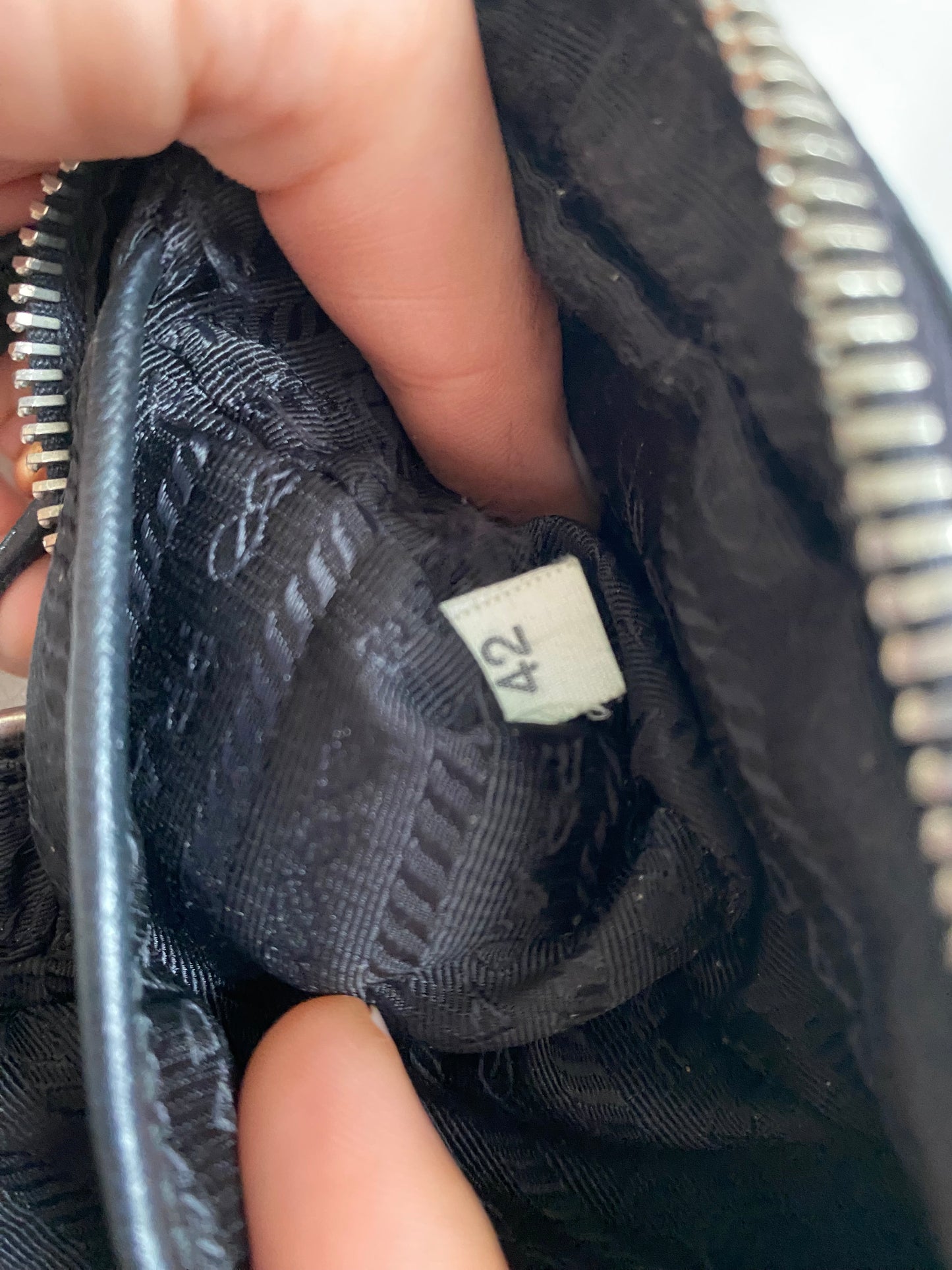 Prada mini grommet