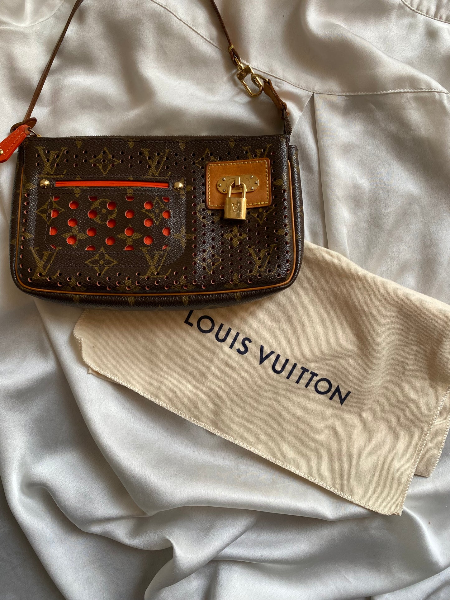 Louis Vuitton pochette accessoire perforated orange