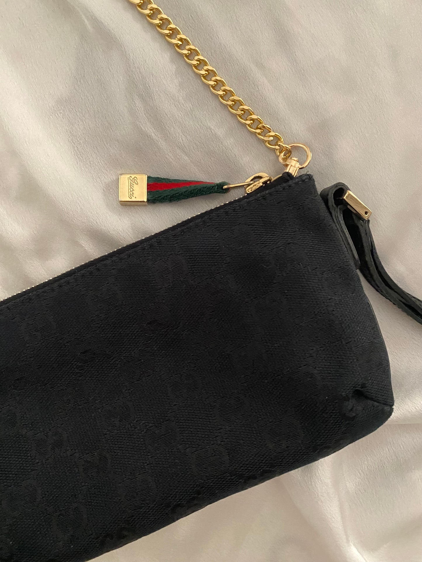 Gucci Pochette monogram  nera canvas con fiocco