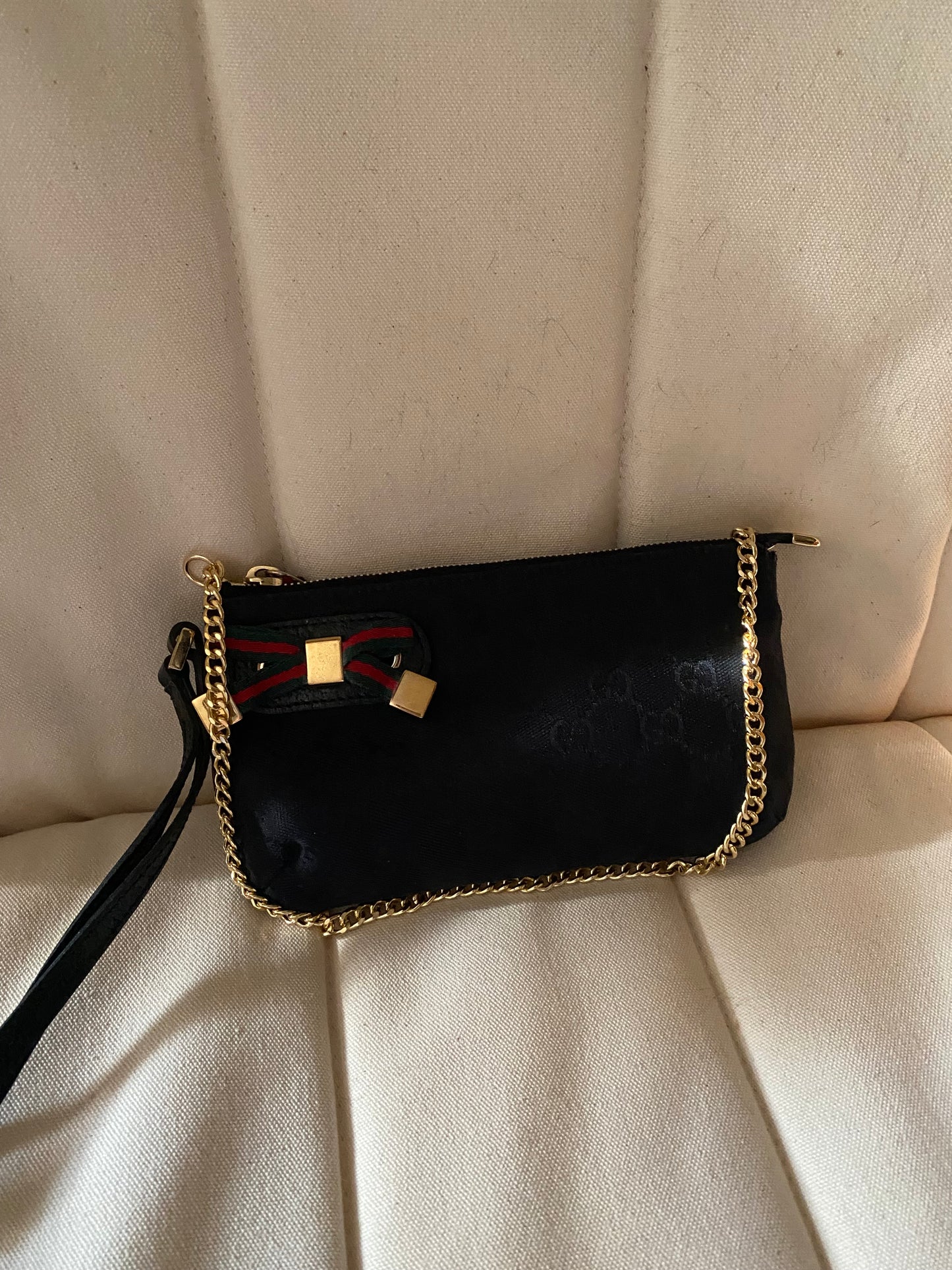 Gucci Pochette monogram  nera canvas con fiocco