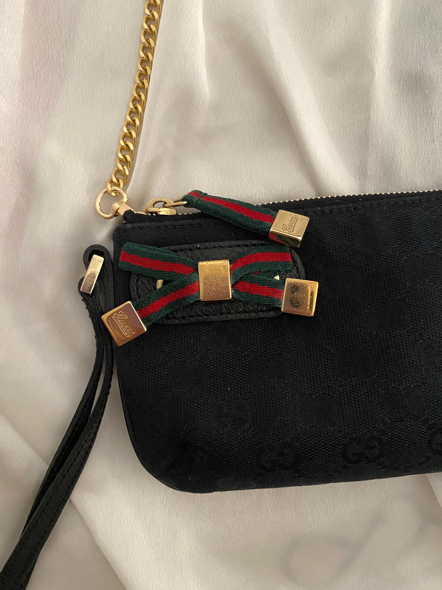 Gucci Pochette monogram  nera canvas con fiocco