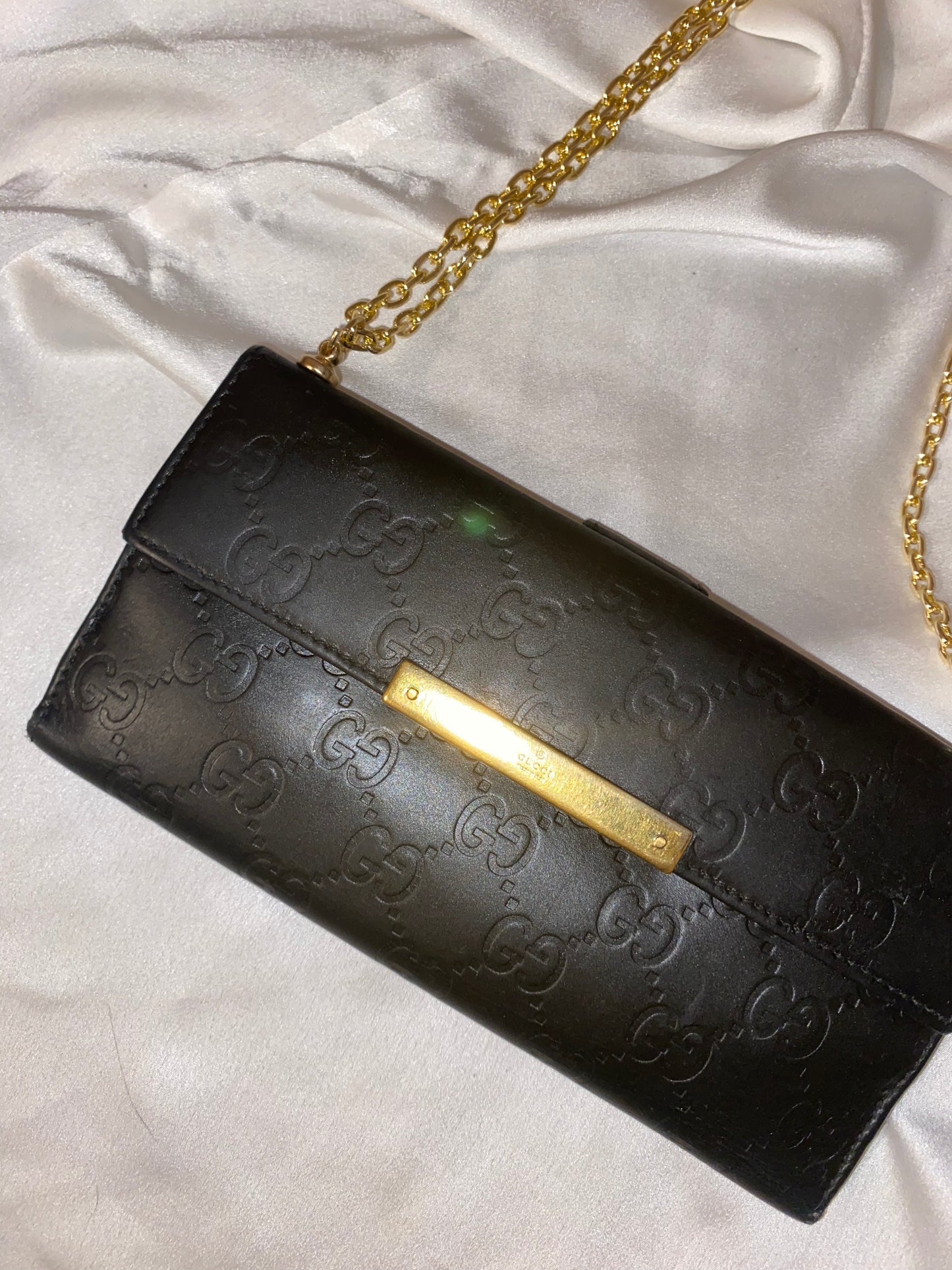 Gucci black embossed clutch bag