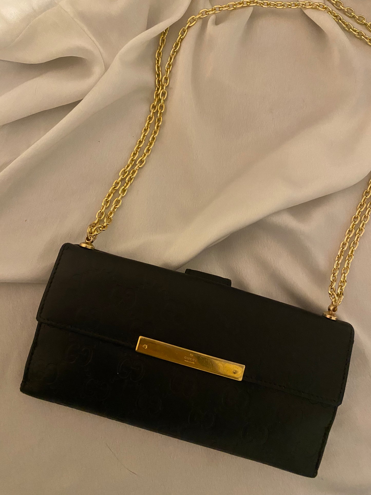 Gucci black embossed clutch bag