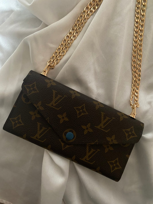 Pochette Louis Vuitton Monogram con interni blu