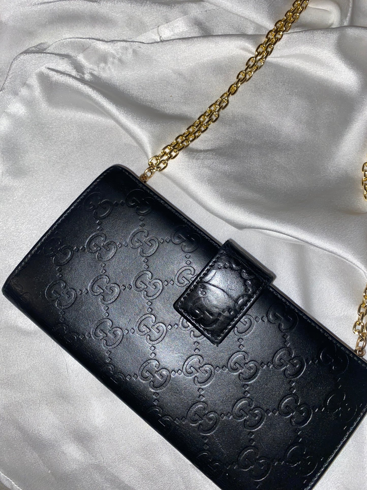 Gucci black embossed clutch bag