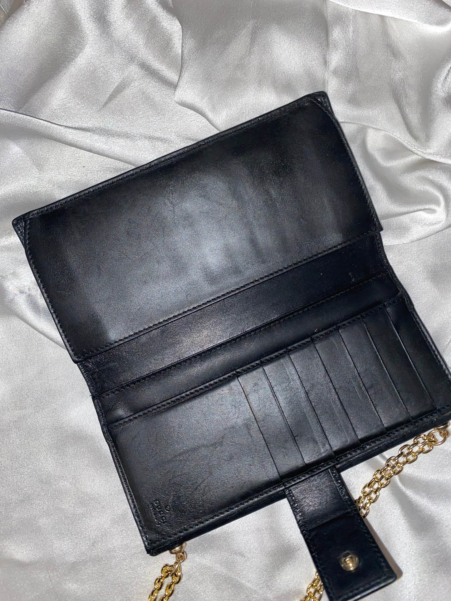 Gucci black embossed clutch bag