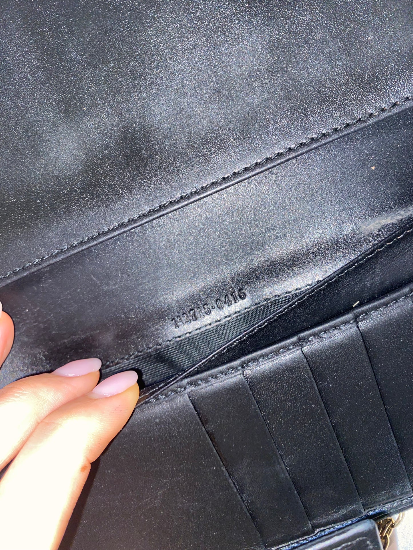 Gucci black embossed clutch bag